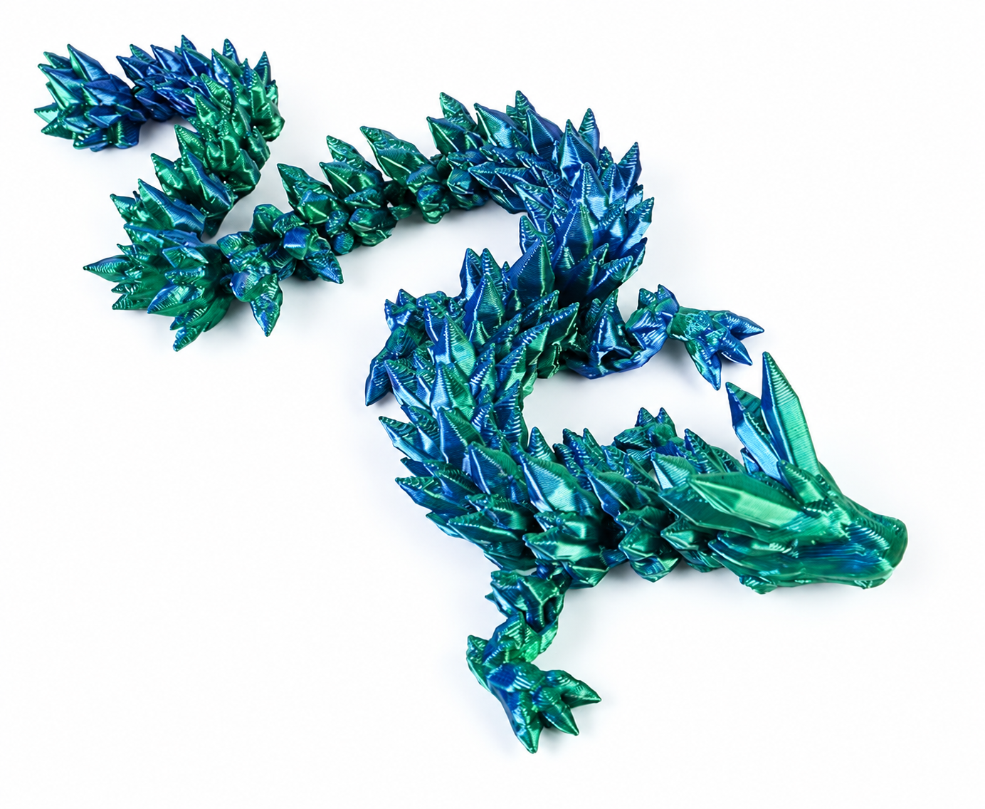 Close-up of an emerald and blue VivaNova dragon, showing its sculpted face, scales, and articulated body